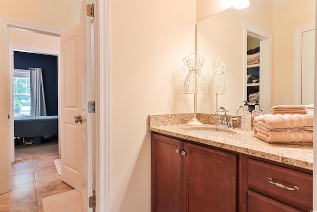 bathroom featuring tile patterned flooring and vanity