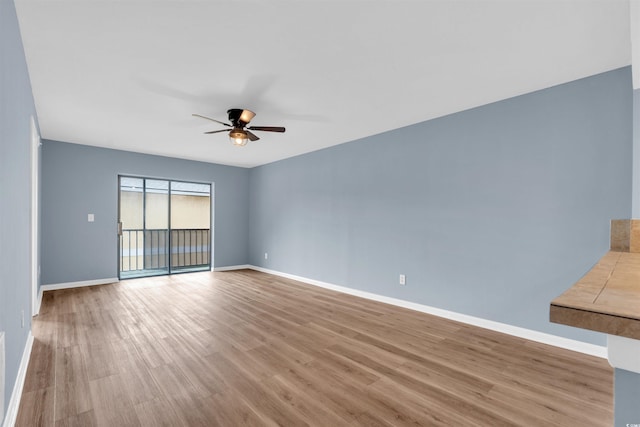 unfurnished room featuring ceiling fan and light hardwood / wood-style floors