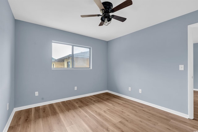 empty room with ceiling fan and light wood-type flooring