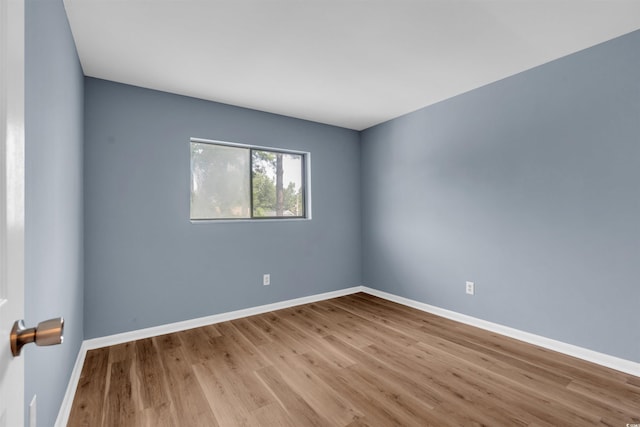 unfurnished room featuring light hardwood / wood-style flooring