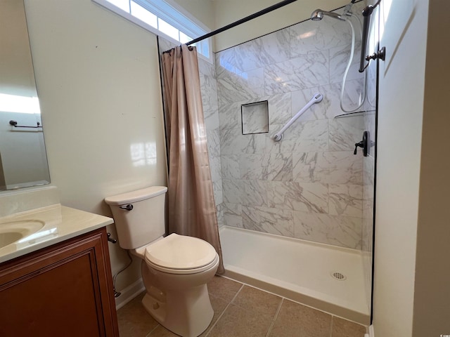 bathroom with tile patterned floors, vanity, and toilet