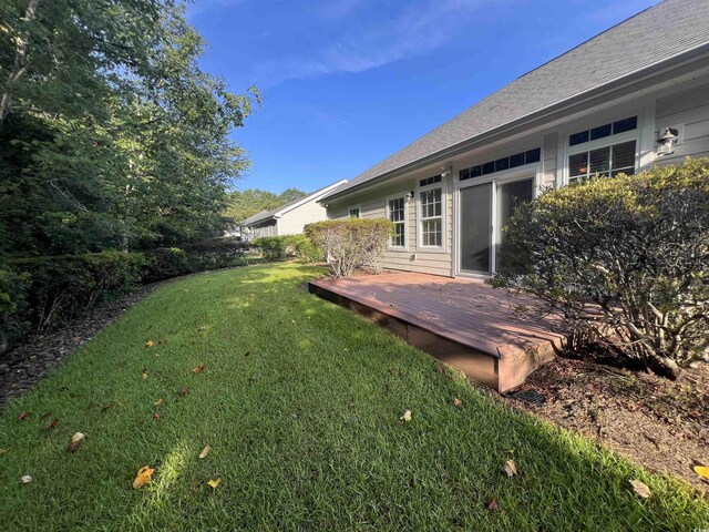 view of yard with a wooden deck