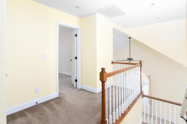 hallway with recessed lighting, carpet floors, visible vents, an upstairs landing, and baseboards