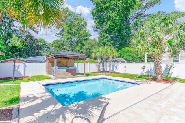 view of swimming pool with a lawn, a patio area, and a fenced backyard