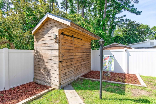 view of shed featuring a fenced backyard