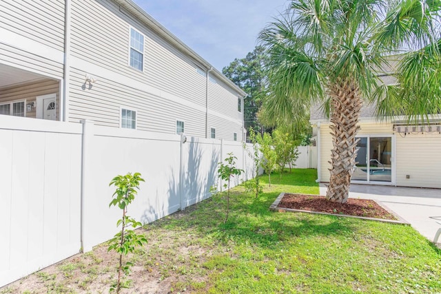 view of yard featuring a patio area and a fenced backyard