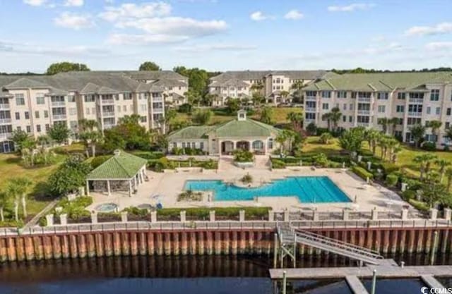 view of swimming pool with a patio