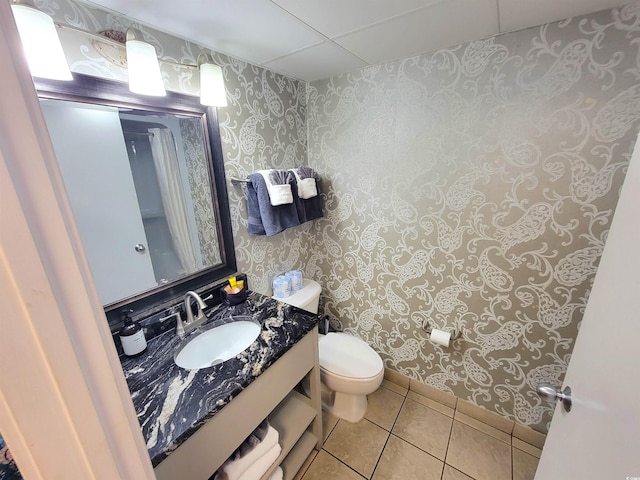 bathroom featuring tile patterned floors, toilet, and vanity