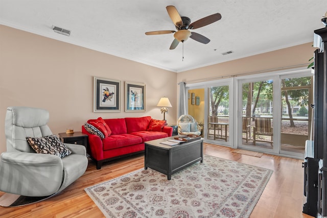 601 Hillside Dr N Unit 2903, North Myrtle Beach, SC 29582 - living room featuring ornamental molding, light wood-style floors, ceiling fan, and a textured ceiling