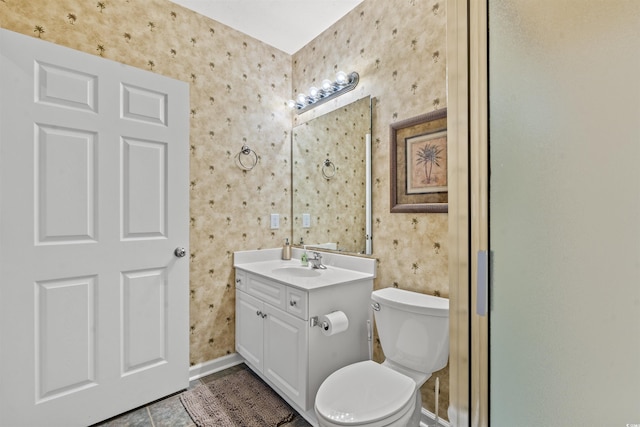 601 Hillside Dr N Unit 2903, North Myrtle Beach, SC 29582 - bathroom featuring wallpapered walls, toilet, vanity, baseboards, and tile patterned floors