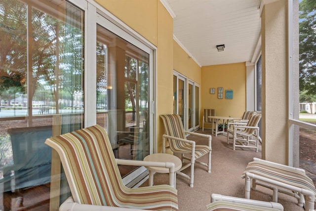 601 Hillside Dr N Unit 2903, North Myrtle Beach, SC 29582 - sunroom with plenty of natural light, carpet floors, and ornamental molding