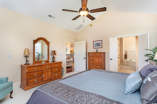 carpeted bedroom featuring ceiling fan, ensuite bath, and high vaulted ceiling