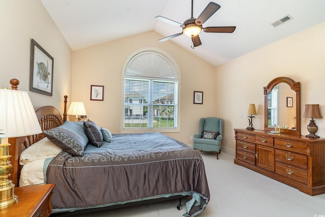 bedroom with ceiling fan, light colored carpet, and lofted ceiling