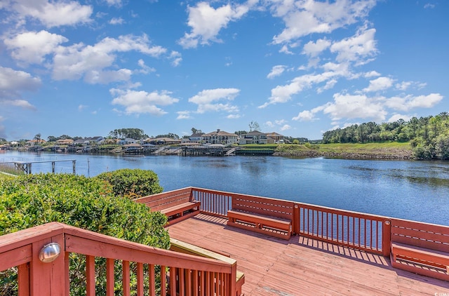 view of dock with a deck with water view