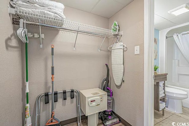 washroom with light tile patterned floors