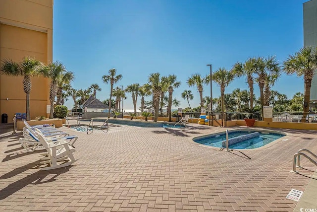 view of swimming pool with a patio area