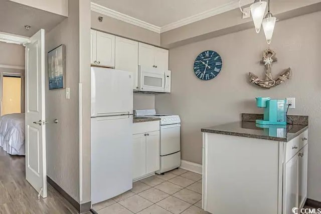 kitchen featuring white cabinetry, light hardwood / wood-style flooring, crown molding, and white appliances