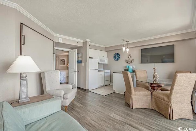 6900 Ocean Blvd N Unit 1410, Myrtle Beach, SC 29572 - living area featuring crown molding, a textured ceiling, and light wood-style flooring