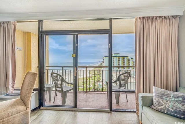 6900 Ocean Blvd N Unit 1410, Myrtle Beach, SC 29572 - entryway with ornamental molding, a water view, and hardwood / wood-style flooring