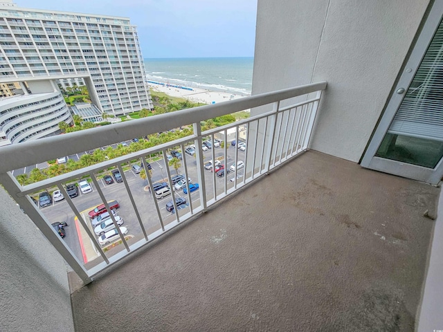 balcony with a view of the beach and a water view