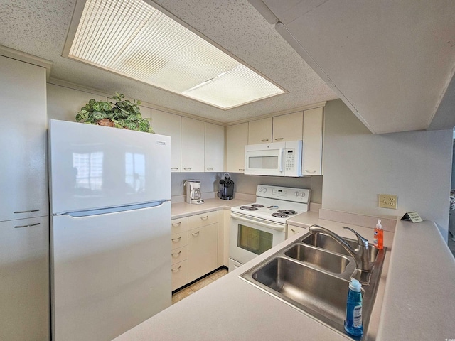 kitchen with sink and white appliances