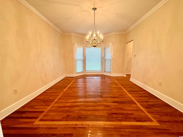 empty room featuring wood-type flooring, crown molding, and an inviting chandelier