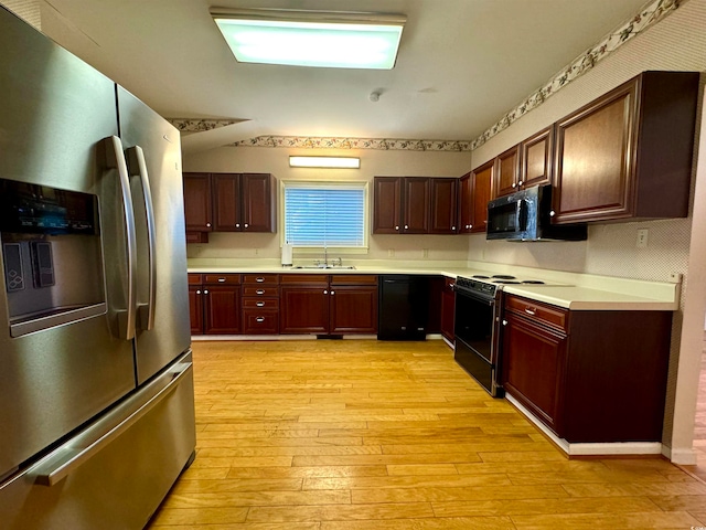 kitchen featuring stainless steel refrigerator with ice dispenser, sink, dishwasher, light hardwood / wood-style flooring, and white electric range oven