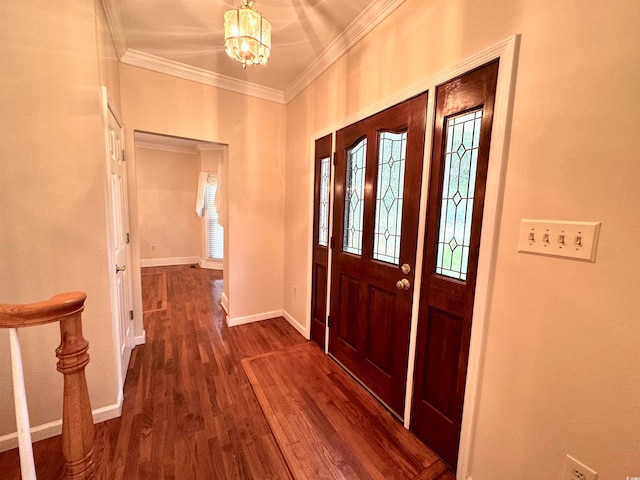 entrance foyer with crown molding, dark hardwood / wood-style floors, and a notable chandelier