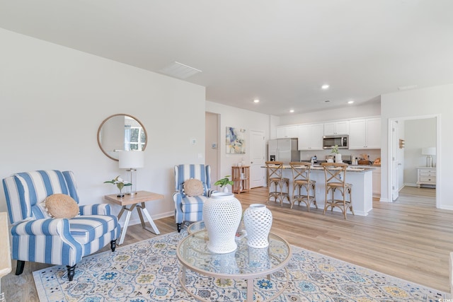 living room featuring light wood-type flooring