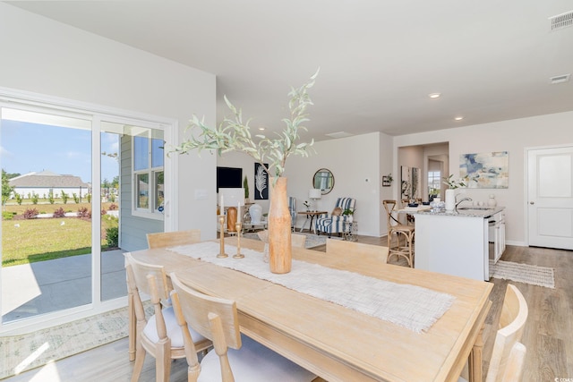 dining room with light hardwood / wood-style floors