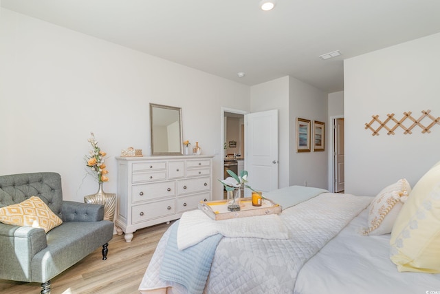 bedroom with light hardwood / wood-style flooring