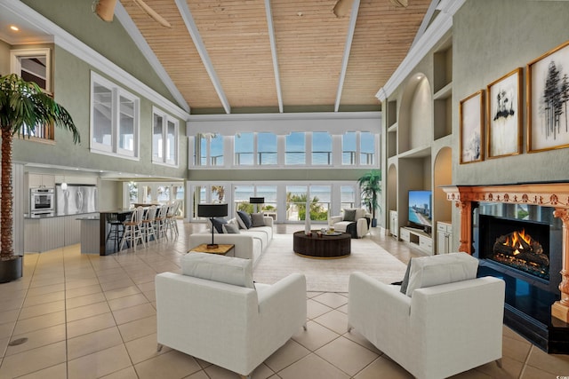 living room featuring high vaulted ceiling, light tile patterned floors, wooden ceiling, a high end fireplace, and beam ceiling