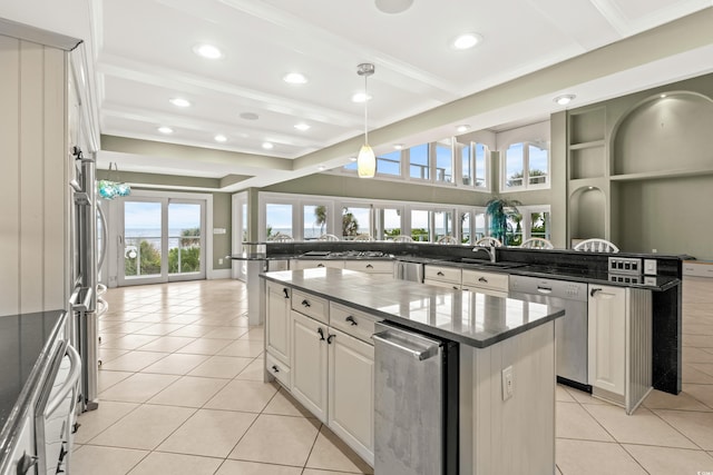 kitchen featuring white cabinetry, dishwasher, a center island, light tile patterned floors, and kitchen peninsula