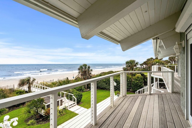 balcony featuring a water view and a view of the beach