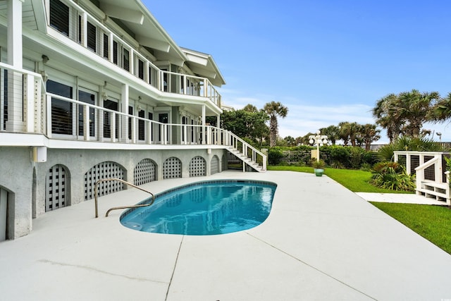 view of swimming pool with a patio