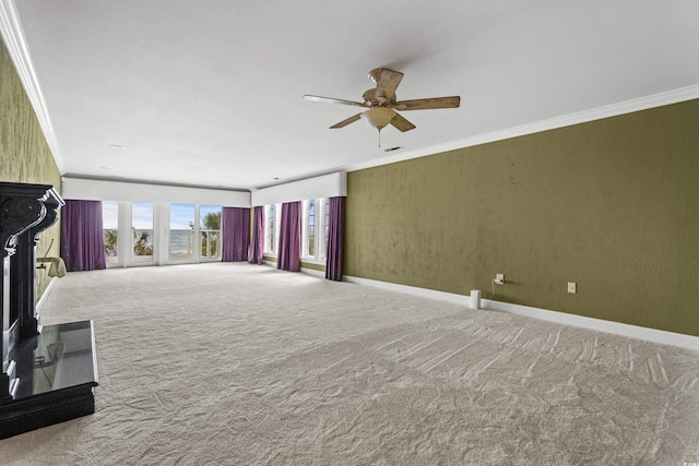 unfurnished living room with ornamental molding, carpet, and a fireplace