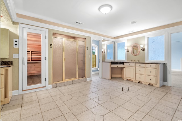 bathroom featuring vanity, tile patterned floors, and walk in shower