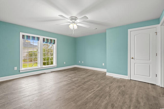 spare room with wood-type flooring and ceiling fan