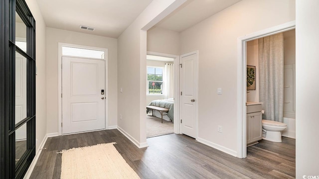 entrance foyer featuring dark wood-type flooring