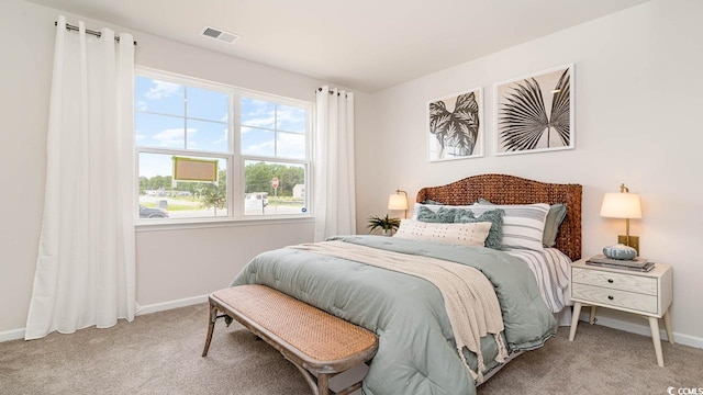 carpeted bedroom featuring multiple windows