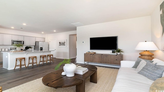 living room featuring dark hardwood / wood-style flooring
