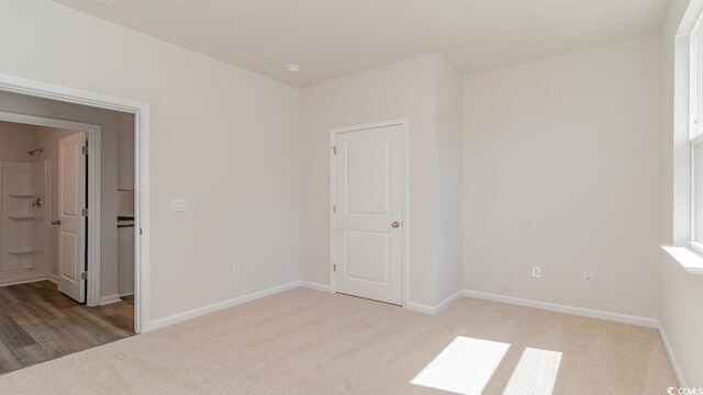 unfurnished room featuring carpet flooring