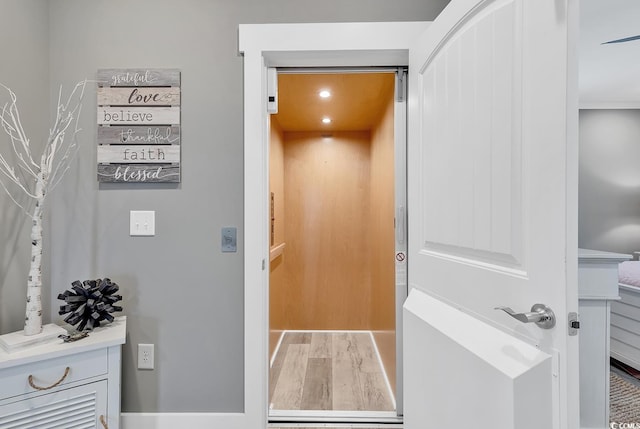 interior space featuring elevator and hardwood / wood-style floors