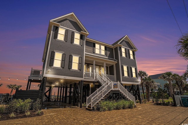 view of front of house featuring a carport and a porch