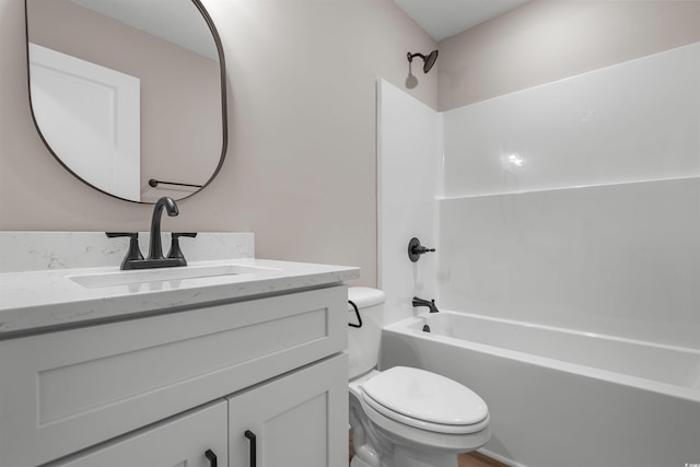 full bath featuring toilet, vanity, and shower / bathing tub combination