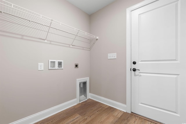 laundry room featuring baseboards, laundry area, hookup for a washing machine, wood finished floors, and electric dryer hookup