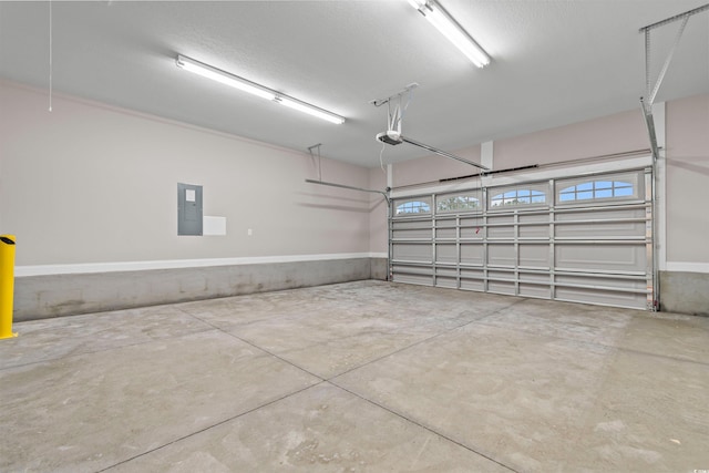 garage with electric panel and a garage door opener