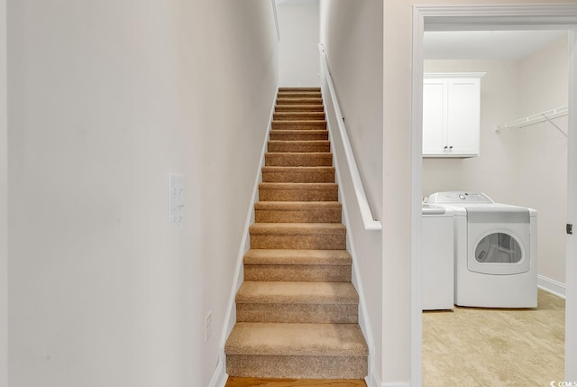 staircase featuring washing machine and dryer