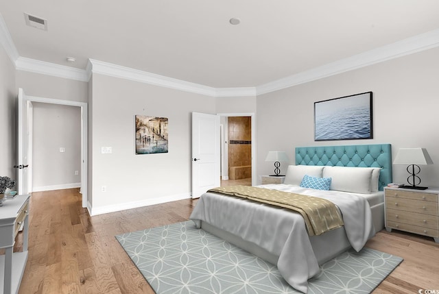 bedroom featuring crown molding and wood-type flooring