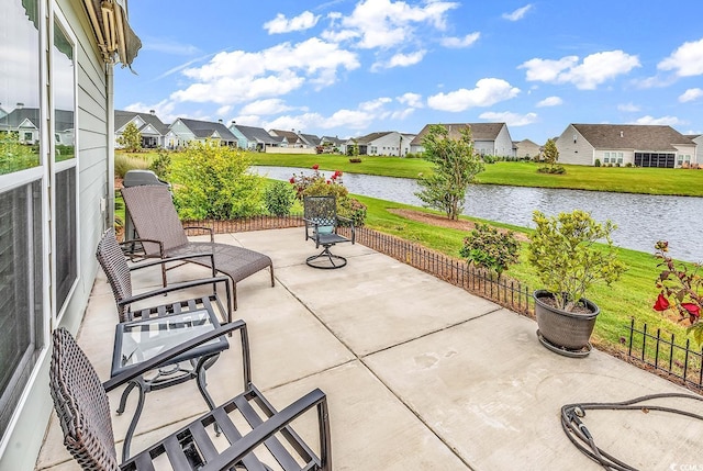 view of patio featuring a water view